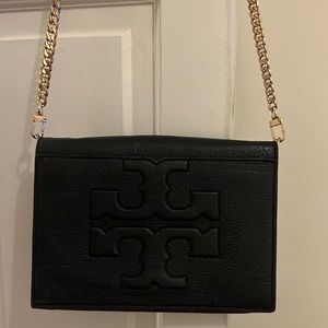 Leather Tory Burch crossbody bag with interchangeable strap.